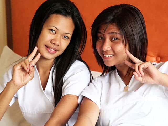 Filipino Nurses in room with horny foreigner posing for camera