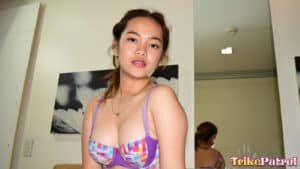 Cute Asian teen in purple bra