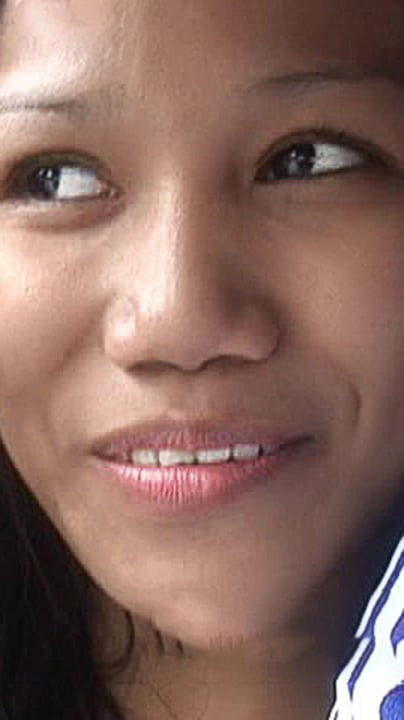 Charmaine Suan looks off into distance