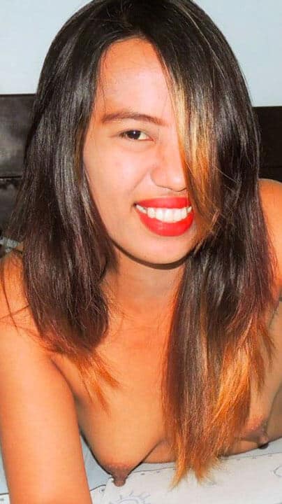 Joy Yasay covers her perky breasts