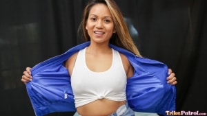 Sexy petite Asian model undresses for photo shoot