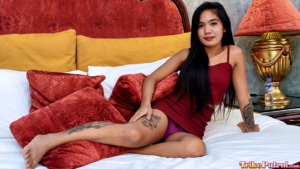 Andrea displays the tattoos on her legs and thigh