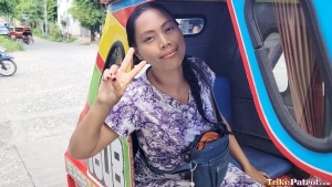 Filipina MILF throws up the peace sign in a trike