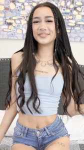 Filipina teen Katie Cai smiles for camera while on bed