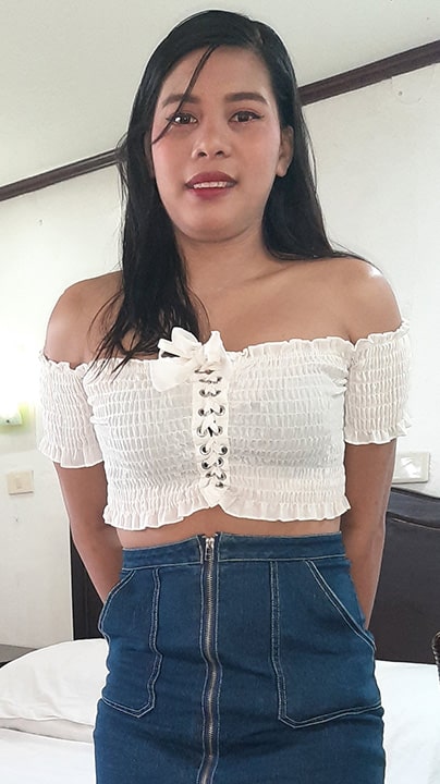 Chubby and joyful Filipina Amira Libog poses for picture in motel room