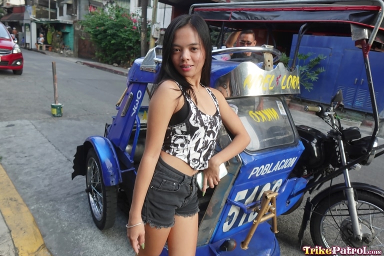 Small frame babe from Manila strike sexy pose by the trike
