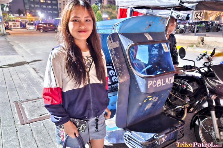 Cute Filipina poses by trike in Manila