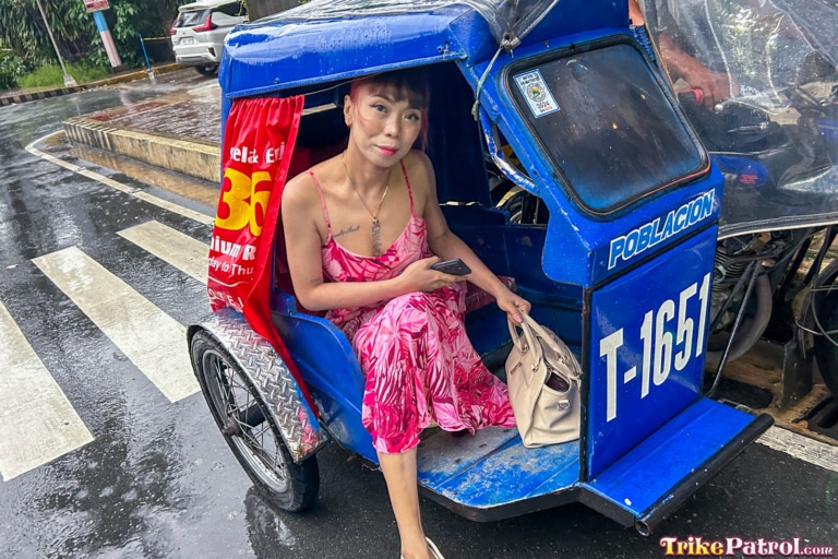Sexy Pinay rides Trike in rainy downtown Manila