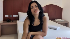 Filipina beauty interviewed on bed