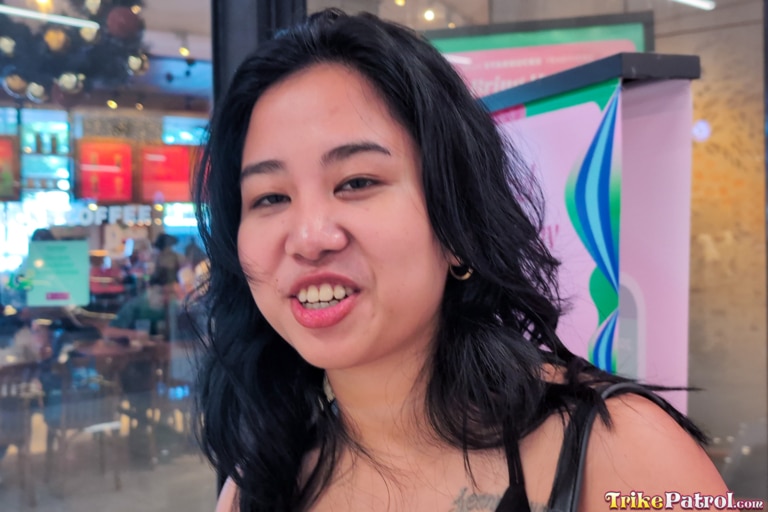 Pretty Pinay shows her cock sucker lips while smiling