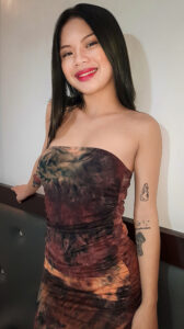 Catherine Yosi poses in pretty dress