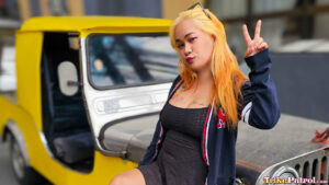 Filipina model poses next to trike with peace sign